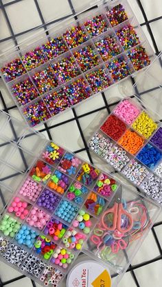 two plastic containers filled with lots of different colored beads