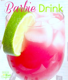 there is a pink drink with lime on the rim