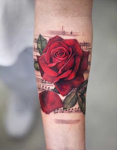 a red rose with music notes on it