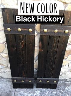 two wooden doors with the words new color black hickory