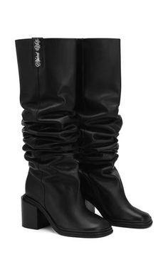 A slouchy shaft brings plenty of modern attitutde to a leather boot complete with polished signature hardware at the block heel. Exclusive retailer 3" heel Pull-on style Leather upper/textile lining/rubber sole Imported Slouchy Leather Boots, Rubber Sole Boots, Women Heel Boots, Naked Wolfe, Black Boots Tall, Tall Boot, Leather Boots Women, Signature Hardware, Leather Boot