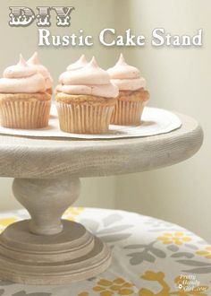 three cupcakes sitting on top of a cake stand with the words diy rustic cake stand