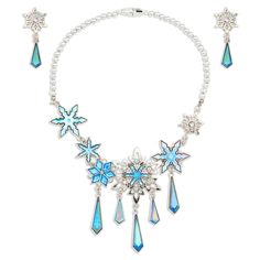 Dazzling jeweled blue snowflakes will fall gently around their neck with this Elsa Jewelry Set. They can complete their transformation into Arendelle's queen with the glamorous Frozen necklace and coordinating drop earrings. Silver bead necklace includes elastic thread and snap fastener for easy on and off. Clip-on silver metal clip snowflake earrings with clear faceted jewel accents. Genuine, Original, Authentic Disney Store Product. Elsa Jewelry, Frozen Necklace, Frozen Jewelry, Elsa Costume, Children's Jewelry, Disney Belle, Cinderella Costume, 3d Jewelry, Christmas Board