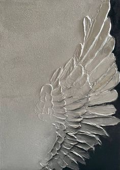 an angel wing on a black and white background