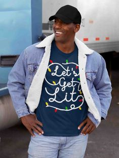 Men's Christmas Lights T Shirt Let's Get Lit Shirt Christmas Shirt Drinking Shirt Party Shirt Funny Christmas Shirt Get lit this Christmas! This funny Christmas t shirt features a string of Christmas lights in a typography that read 'Let's Get Lit'. The holidays can be so stressful. De-stress. Get lit and share a laugh with family and friends this holiday season. Made of soft ring spun cotton and includes a cotton muslin drawstring gift bag. Made of soft ring spun cotton and includes a cotton mu Mens Christmas Shirts, Lets Get Lit, Drawstring Gift Bag, Funny Christmas Tshirts, Funny Christmas Shirts, Hoodie Size Chart, Drinking Shirts, Christmas Men, Thanksgiving Shirts