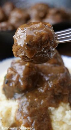 A meatball being held up over a plate of fluffy mashed potatoes. Meatball Appetizer Recipes, Simple Appetizer, Cube Steak Recipes, Eat Beef