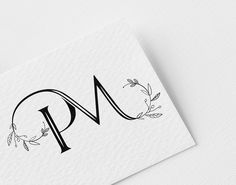 the letter p is made up of leaves and vines on top of a white card