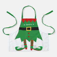 an apron with the words santa written on it and a green elf's hat