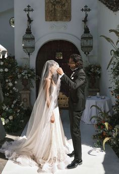 a bride and groom are getting ready to walk down the aisle at their wedding ceremony