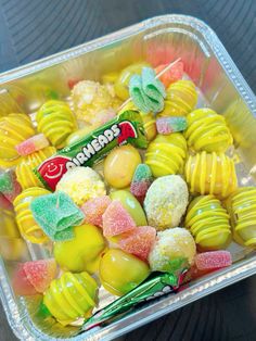 a plastic container filled with assorted candies