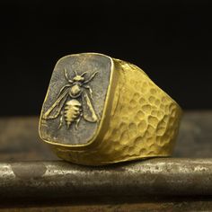 Greek Art Ring | Honey Bee Two Tone Ring | 24K Gold Plated 925 Sterling Silver | Gold Bee Coin Signet Ring | Roman Art Jewelry Metal : 925 Sterling Silver Coin : Reproduction Bronze Coin Plated : 24K Gold Ring Size : 33 x 23.3 mm Ring Weight : 21.7 grams Ring Size : US 10 (The size you want is made for free). (We used the US standard sizing) **Custom Orders is Made** As pellada family, we will be happy to help you if you contact us with the photo and dimensions of the design you want. To return Handmade Brass Yellow Gold Signet Ring, Handmade Yellow Gold Brass Signet Ring, Hand Cast Yellow Gold Signet Ring Gift, Hand-cast Yellow Gold Signet Ring As Gift, Unique Brass Signet Ring Gift, Unique Brass Signet Ring For Gift, Hand-cast Yellow Gold Signet Ring For Gift, Gold Hand Cast Rings For Gifts, Hand Cast Gold Rings For Gift