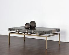 two metal balls sitting on top of a coffee table