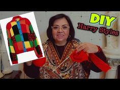 a woman holding up a colorful sweater with the words diy harry styles on it