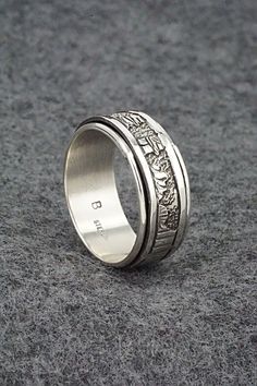 This sterling silver spinner worry/meditation ring featuring a southwest landscape was made by Navajo silversmith Elaine Becenti. The inside is signed B and stamped sterling.Size: 11.5Width: 3/8"Free shipping on all orders! We ship with USPS and always include tracking. All orders ship within a day of payment.Returns are accepted up to 30 days after you receive your order. Just send us a message. Our shop offers cash back or store credit. The item must be returned in new condition. Southwest Landscape, Meditation Ring, Meditation Rings, Silver Spinner Rings, Spinner Ring, Spinner Rings, Meditation, Sterling Silver, Ring