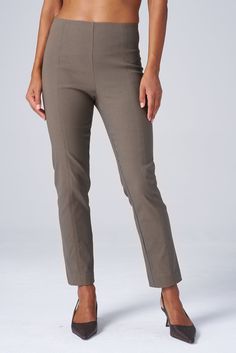 The slim, ankle-length version of the Original Magic Pant—the iconic piece that started it all. Designed to hug your curves perfectly, these pants blend structure with stretch for effortless all-day style. Whether dressing up for a presentation or going casual for coffee, meet your versatile go-to from 9 to 5 and beyond. THE DETAILS High-waisted, pull-on construction with no zippers or side seams offers a sleek, flattering silhouette. Perfect blend of structure and stretch holds you in all the r Pant For Women, 9 To 5, Classic Pants, Black Khakis, Denim Pant, Work Pants, Color Khaki, Black And Navy, Ankle Length