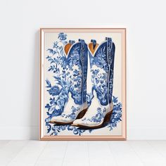 a blue and white painting with cowboy boots on it