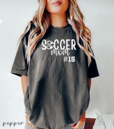 Personalized Soccer Mom Shirt, Soccer Mom Personalized Number Shirt, Soccer Mom Personalized Number Gift, Custom Soccer Number, Soccer Shirt 👉 Personalized Soccer Mom Comfort Colors 1717 T-shirt - 100% Airlume combed and ringspun cotton - Soft cotton and quality print make users fall in love with it over and over again. - These t-shirts have-ribbed knit collars to bolster shaping. - Printed and shipped from the USA CARE INSTRUCTIONS - Wash inside out with like colors. - Tumble dry or hang to dry. - Try not to iron directly over the design. Iron if necessary! 🛒 HOW TO ORDER 1) Please, review all photos 2) Choose your sweatshirt or t-shirt style, color, and size. 3) PLEASE make sure all your order's steps 4) Add your custom 5) Click add to cart. You can go back and follow the same steps to Soccer Number, Soccer Tshirt, Soccer Mom Shirt, Mama Hoodie, Number Shirt, Mom Tshirt, Diy Shirts, Soccer Shirt, Mama T Shirt