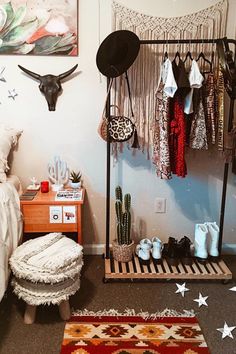 a bedroom with an animal head hanging on the wall next to a bed and rug