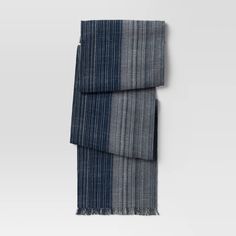 a blue and grey striped scarf on a white background