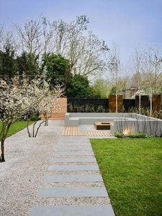 an empty garden with stone steps leading to the back yard