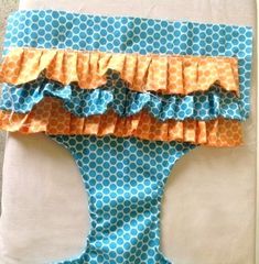 a blue and orange piece of cloth with ruffles on it