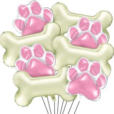 pink and white dog paw balloons in a bouquet