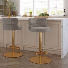 two grey and gold bar stools in a kitchen