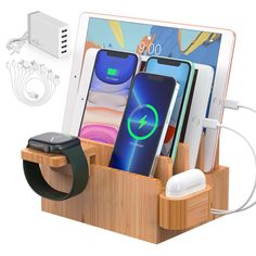 an apple watch and other electronic devices in a wooden docking station with charging plugs