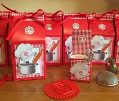 red and white boxes with utensils in them