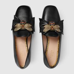 Shop the Leather ballet flat with bow by Gucci. The point toe ballet flat pump is embellished with an oversize leather bow with center bee detail. The bee—encrusted with pearl effect studs and enamel details that reflect the Web stripe—was first introduced by Gucci in the 1970s. Queen Margaret, Ballet Flats Black, Women Loafers, Charles Jourdan, Gucci Loafers, Shoes Gucci