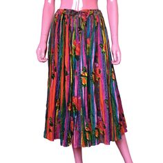 For the artistic soul, this gauzy, candy colored broomstick skirt is printed with jewel tone roses and vertical stripes in bright shades of periwinkle, lavender, purple, cerulean blue, turquoise, magenta, fuchsia, pink, red-orange, golden yellow, emerald green, and touches of brown and black. Condition: Great preowned vintage condition with no holes, rips, or stains. Seam to seam measurements laying flat, double where needed: 17" waist, intended to be cinched with drawstring 24" hips 31.5" waist to hem Size tag SP Details & care: 100% Cotton No stretch to the fabric Hand wash cold Line dry in twisted shape to retain crinkles Non-chlorine bleach when needed Do not iron Gauzy with crinkle pleats Lightweight and flowing Drawstring waist Midi / below-the-knee length A-Line silhouette Unlined / Broomstick Skirt, Cerulean Blue, Skirt Midi, Printed Drawstring, Lavender Purple, Fuchsia Pink, Hippie Chic, Vertical Stripes, Golden Yellow