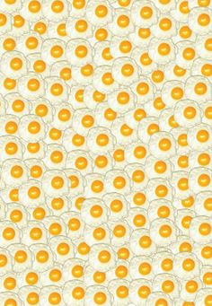 an orange and white pattern with eggs on it