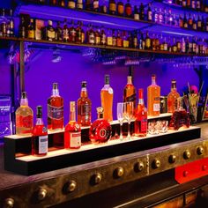 the bar is stocked with many different types of liquor