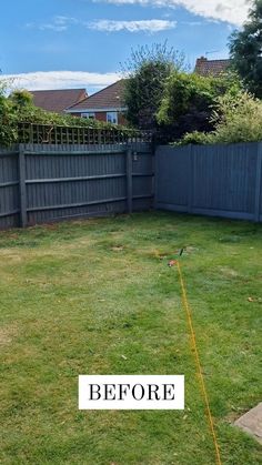 an empty backyard with the words before and after painted in white on it's lawn