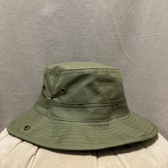 Elevate your outdoor adventures with our Green Safari Hat, a versatile and stylish accessory designed for those who love exploring the great outdoors. Whether you're hiking through rugged terrain, lounging on the beach, or embarking on a summer vacation, this hat has got you covered. Key Features: SAFARI-READY: Crafted with outdoor enthusiasts in mind, our Green Safari Hat is perfect for safaris, hikes, and all your outdoor escapades. SUN PROTECTION: Stay shielded from the sun's harsh rays with Durable Adjustable Bucket Hat For Outdoor, Durable Casual Bucket Hat With Curved Brim, Casual Durable Bucket Hat With Curved Brim, Durable Bucket Hat For Outdoor Activities, Adjustable Bucket Hat For Fishing, Durable Adjustable Bucket Hat For Camping, Adjustable Durable Bucket Hat For Camping, Durable Adjustable Bucket Hat, Adjustable Brimmed Bucket Hat For Outdoor Activities