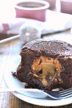 a piece of chocolate cake on a plate with a fork