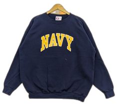 Navy Letter Print Sweater For Winter, Blue Varsity Sweater For Streetwear, Navy Sweatshirt For Winter Streetwear, Navy Crew Neck Sweatshirt With Logo, Navy Crew Neck Sweatshirt With Logo Print, Navy Crew Neck Sweatshirt For Streetwear, Navy Sporty Sweater For Streetwear, Navy Collegiate Crew Neck Sweatshirt, Navy Sweater With Ribbed Cuffs For Streetwear