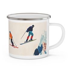 a white enamel mug with skiers on it