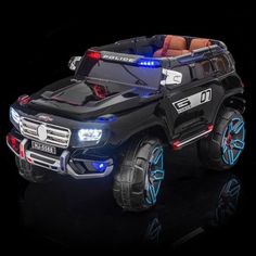 a black toy truck with lights on it