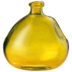 a yellow glass vase sitting on top of a white table