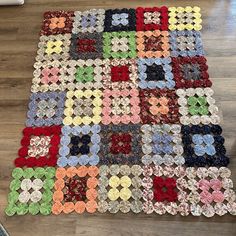 a multicolored patchwork rug on the floor