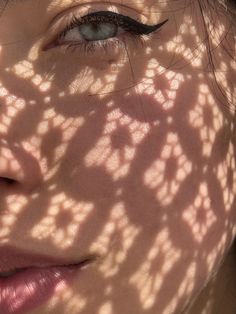 a woman's shadow cast on her face