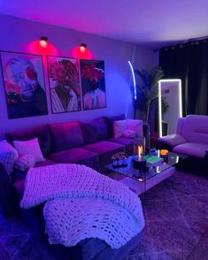 a living room filled with furniture and purple lighting