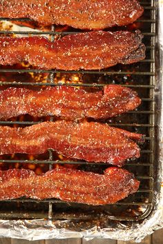 bacon is cooking on the grill and being grilled for dinner or as an appetizer