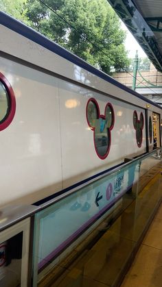 a white train with mickey ears on it's side