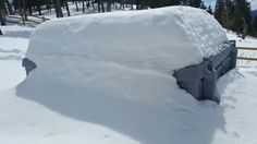 a pile of snow sitting on the side of a road