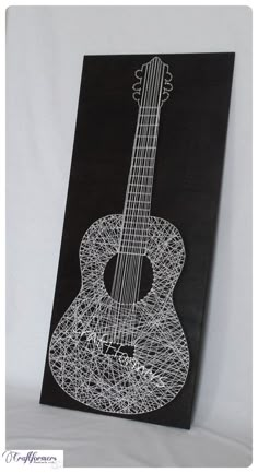 a string art drawing of an acoustic guitar