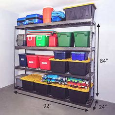 a large metal shelving unit with various bins and containers on the bottom shelf