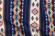 a multicolored striped fabric with geometric designs