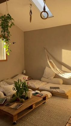 a living room with a hammock hanging from the ceiling